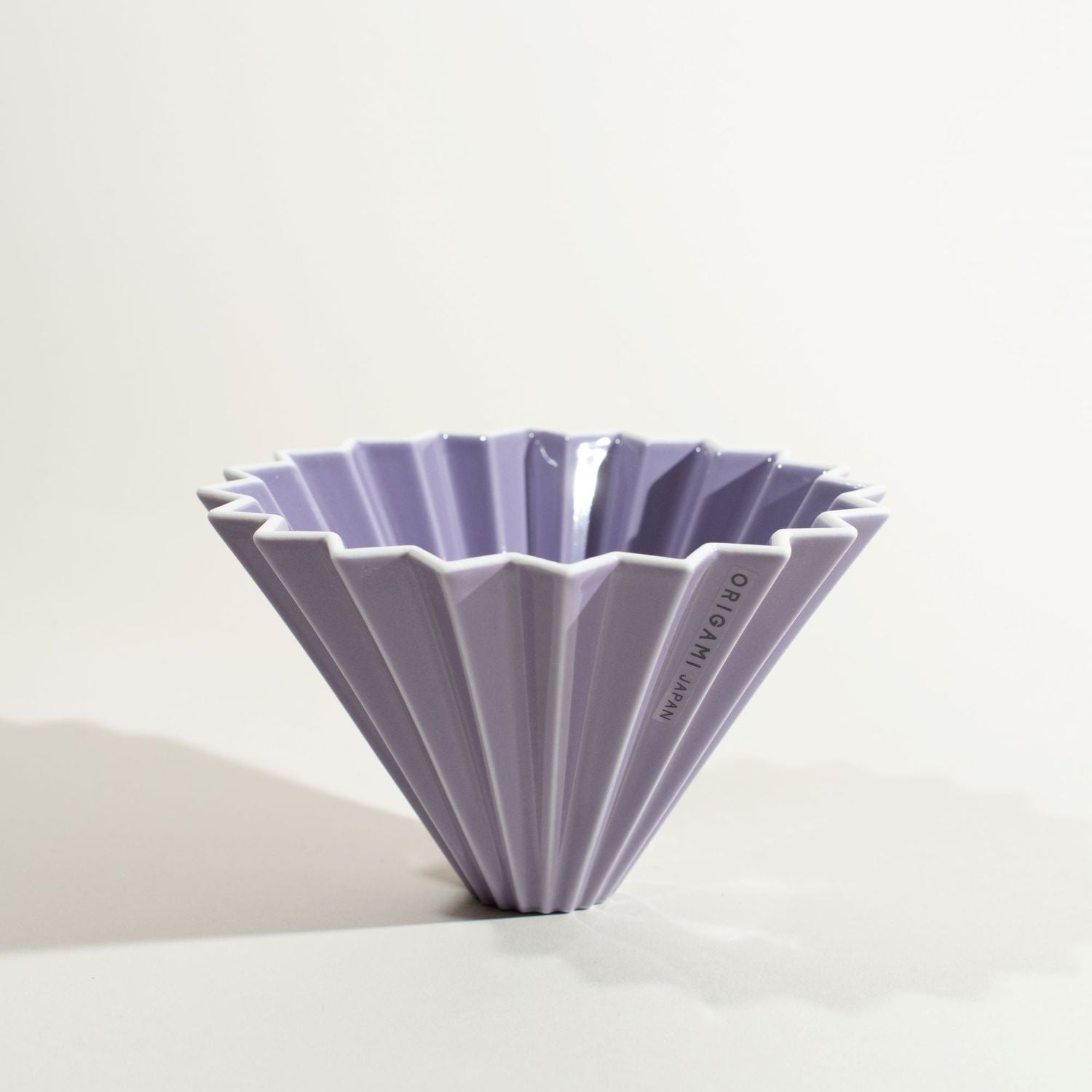 PURPLE ORIGAMI COFFEE DRIPPER, MADE IN JAPAN WITH MINO PORCELAIN, IT LOOKS LIKE A FOLDED ORIGAMI JUST LIKE ITS NAME SUGGESTS.