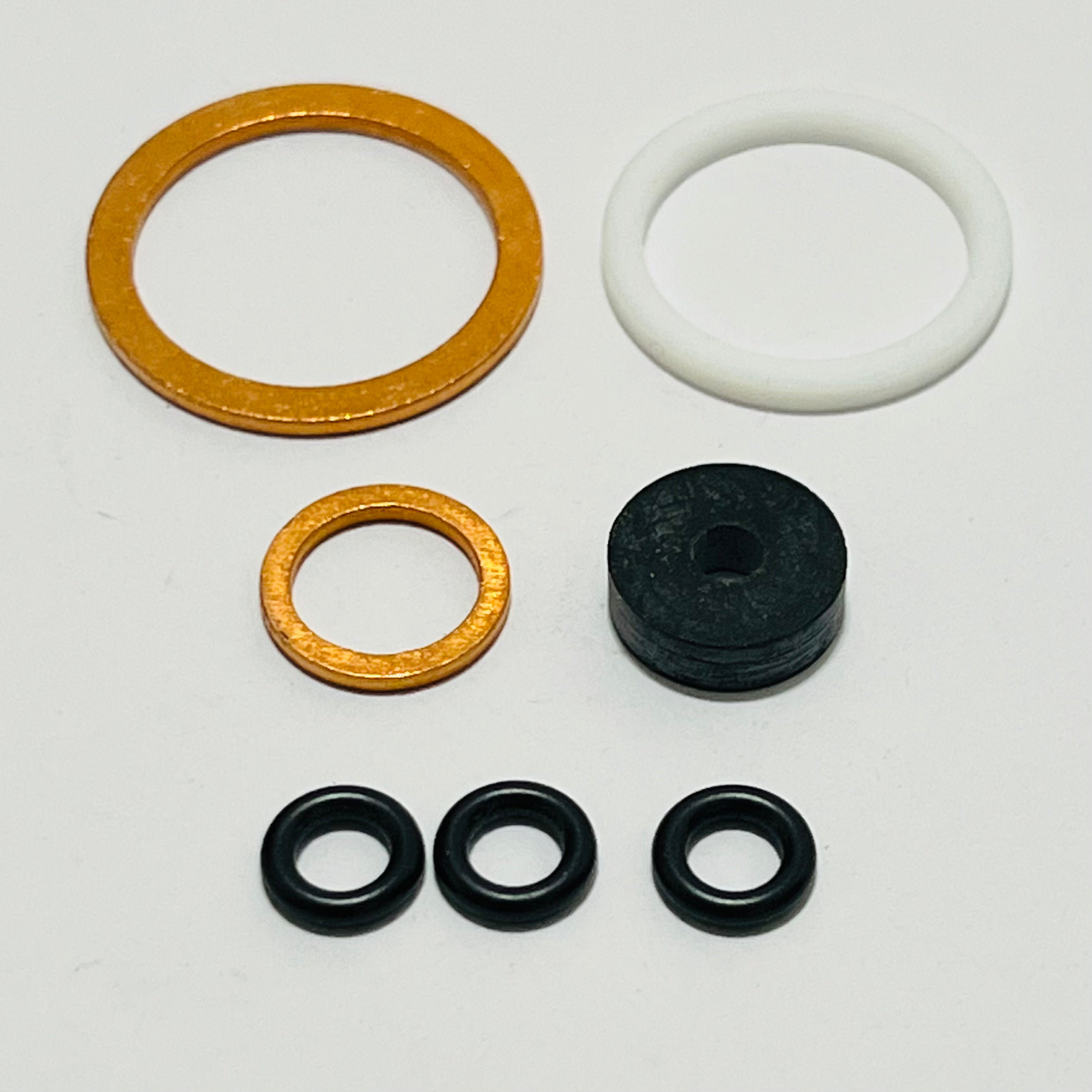 La Marzocco Steam Valve Rebuild Kit components for Strada MP, displayed individually, including gaskets, O-rings, and washers for detailed inspection."