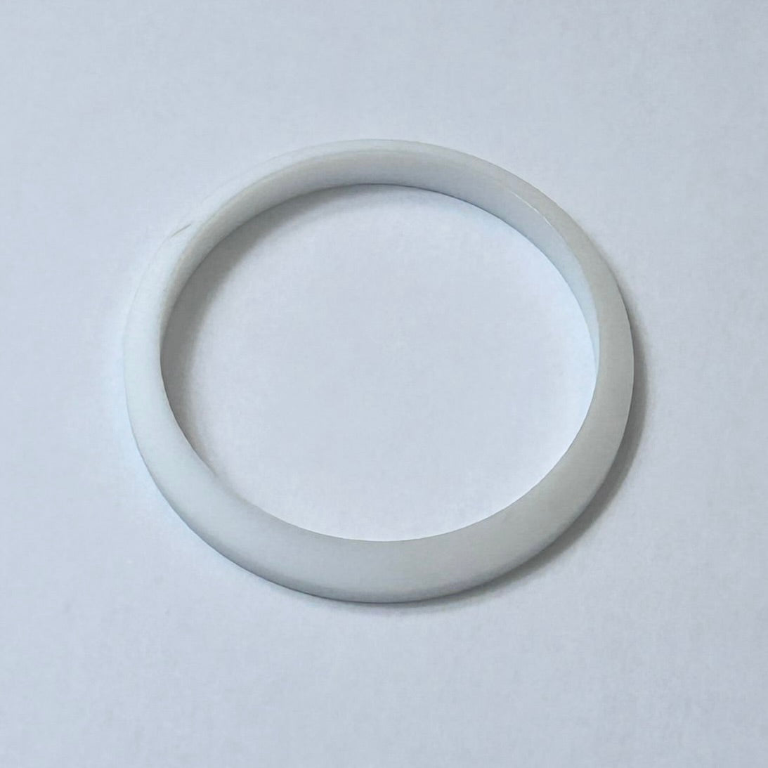 Line drawing of a Teflon gasket for a boiler heating element.

